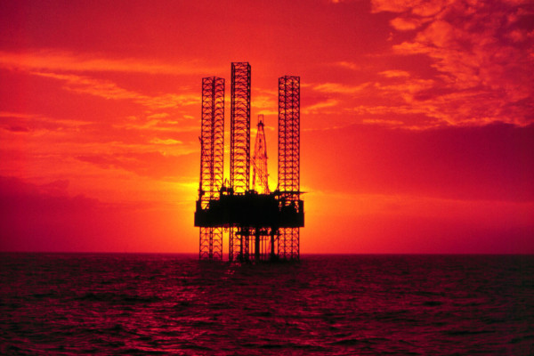 378913 01: Pennzenergy Company Oil Exploration Drilling Rig In The Gulf Of Mexico During Sunset.  (Photo By Getty Images)